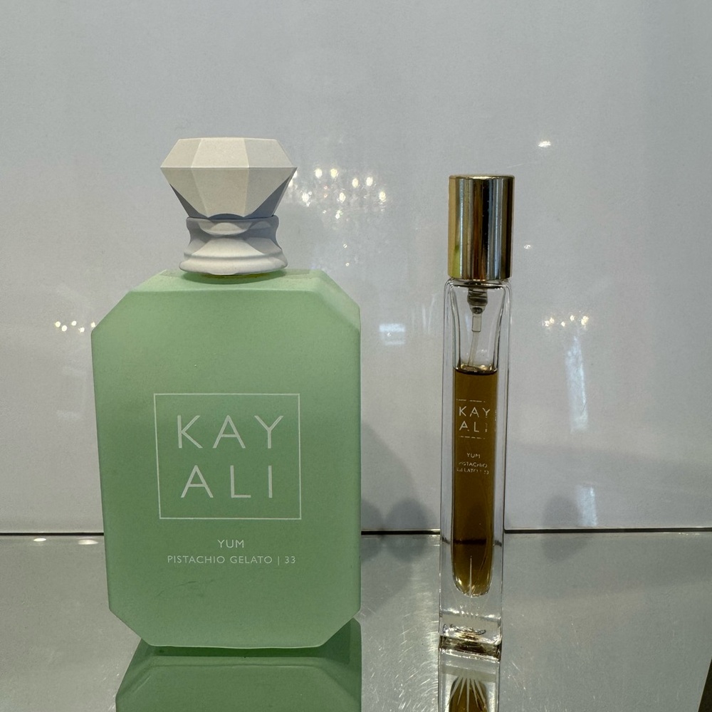 3.4 oz Kayali Yum Pistachio Gelato and travel spray 75% full
